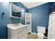 Bathroom featuring blue walls and a shower/tub combination at 165 Wellington Dr, Mcdonough, GA 30252