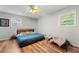 Bedroom showcasing hardwood floors and a ceiling fan at 165 Wellington Dr, Mcdonough, GA 30252