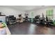 Spacious room with multiple desks and chairs; ideal for an office at 165 Wellington Dr, Mcdonough, GA 30252