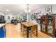 Spacious dining area with hardwood floors, next to the living area and kitchen at 165 Wellington Dr, Mcdonough, GA 30252