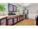 Stylish kitchen featuring unique painted cabinets and modern appliances at 165 Wellington Dr, Mcdonough, GA 30252