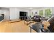 Cozy living room with hardwood floors, soft sofas, and bright natural light at 165 Wellington Dr, Mcdonough, GA 30252