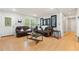 Bright living room with hardwood floors, neutral walls, and large comfortable seating at 165 Wellington Dr, Mcdonough, GA 30252