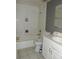 Bathroom featuring a shower-tub combo, vanity, and tile flooring at 3083 Colonial Way # E, Atlanta, GA 30341