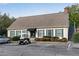 Exterior view of the clubhouse in a community with a golf cart parked out front with ample parking at 3083 Colonial Way # E, Atlanta, GA 30341