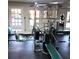 Bright exercise room featuring weight machines, mirrors, and multiple windows at 3083 Colonial Way # E, Atlanta, GA 30341