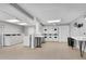 Clean, well-lit laundry room with multiple washers and dryers, and folding tables at 3083 Colonial Way # E, Atlanta, GA 30341