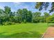 Expansive grassy field with mature trees, perfect for outdoor activities at 3083 Colonial Way # E, Atlanta, GA 30341