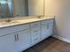 Bathroom with double sinks, quartz counters and vanity with storage at 344 Riverwood Pass, Dallas, GA 30157