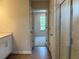 Bright bathroom view into bedroom with glass door shower at 344 Riverwood Pass, Dallas, GA 30157