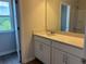 Well-lit bathroom featuring a sink, vanity and tile flooring at 344 Riverwood Pass, Dallas, GA 30157