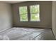 Bright bedroom featuring two bright windows and neutral walls at 344 Riverwood Pass, Dallas, GA 30157