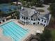 Aerial view of a clubhouse and swimming pool with tennis courts in the background at 344 Riverwood Pass, Dallas, GA 30157