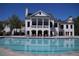 View of the clubhouse with an olympic style swimming pool in the foreground at 344 Riverwood Pass, Dallas, GA 30157