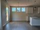 Open dining area with natural light streaming through the windows at 344 Riverwood Pass, Dallas, GA 30157
