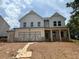 Charming two-story home with a spacious two-car garage and inviting front porch at 344 Riverwood Pass, Dallas, GA 30157