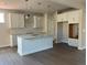 Bright kitchen featuring white cabinets, an island, and stainless steel appliances at 344 Riverwood Pass, Dallas, GA 30157