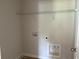Empty laundry room with a wire shelf above at 344 Riverwood Pass, Dallas, GA 30157
