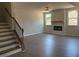 Spacious living room with a fireplace, ceiling fan, and hardwood flooring at 344 Riverwood Pass, Dallas, GA 30157