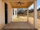 This outdoor patio offers neutral paint, a ceiling fan and sturdy pillars for support at 344 Riverwood Pass, Dallas, GA 30157