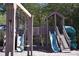 A wooden playground set with a slide, climbing area, and swings at 344 Riverwood Pass, Dallas, GA 30157