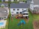 Aerial view showcasing the backyard, deck, screened porch, and play set in this beautiful house at 4020 Connolly Ct, Roswell, GA 30075