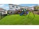 Expansive backyard showcasing a playset, spacious lawn, and outdoor living areas for entertaining and recreation at 4020 Connolly Ct, Roswell, GA 30075
