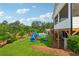 A picturesque backyard featuring a playset, lush lawn, and a glimpse of a swimming pool for outdoor Gathering fun at 4020 Connolly Ct, Roswell, GA 30075