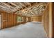 Unfinished basement with exposed beams and framing, offering a blank canvas for customization and expansion at 4020 Connolly Ct, Roswell, GA 30075