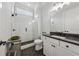 Modern bathroom featuring a glass-enclosed shower, dark countertops, and sleek fixtures for a spa-like feel at 4020 Connolly Ct, Roswell, GA 30075
