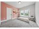 Bright bedroom with a modern bed frame, large windows offering natural light, and neutral-toned walls at 4020 Connolly Ct, Roswell, GA 30075