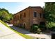 Brick building featuring traditional architecture, nestled beside a picturesque park and walkway at 4020 Connolly Ct, Roswell, GA 30075