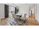 Elegant dining room with hardwood floors, modern lighting, and neutral color scheme at 4020 Connolly Ct, Roswell, GA 30075