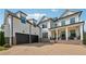 Charming two-story home with white siding, dark accents, and a two-car garage at 4020 Connolly Ct, Roswell, GA 30075