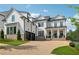 Stunning two-story home with white siding, brick accents, and a two-car garage at 4020 Connolly Ct, Roswell, GA 30075