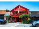 A vibrant red building with a balcony adorned with flags, inviting exploration and discovery at 4020 Connolly Ct, Roswell, GA 30075