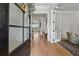 Elegant foyer with hardwood floors, modern lighting, and open doorway at 4020 Connolly Ct, Roswell, GA 30075