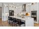 Bright kitchen with white cabinets, stainless steel appliances, and a large center island with seating at 4020 Connolly Ct, Roswell, GA 30075