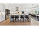 Bright, modern kitchen featuring a large island with seating and stainless steel appliances at 4020 Connolly Ct, Roswell, GA 30075