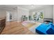 Open landing area featuring hardwood floors, a colorful rug, and a functional layout for various activities at 4020 Connolly Ct, Roswell, GA 30075
