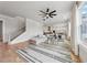 Spacious living room with hardwood floors, large windows, and a cozy sectional sofa at 4020 Connolly Ct, Roswell, GA 30075