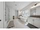 The main bathroom features a glass shower, a soaking tub under a window, and double vanities at 4020 Connolly Ct, Roswell, GA 30075
