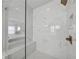 The main bathroom has a large glass shower with marble tile, a bench, and a rain shower head at 4020 Connolly Ct, Roswell, GA 30075