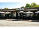 Charming restaurant with outdoor seating under striped umbrellas, creating a welcoming atmosphere at 4020 Connolly Ct, Roswell, GA 30075