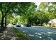 Street view featuring tree-lined streets with modern vehicles on the pavement at 4020 Connolly Ct, Roswell, GA 30075