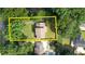 Aerial view showcases property boundaries, neighboring homes, and mature trees at 1177 Castle Way Way, Norcross, GA 30093