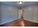 Bedroom features hardwood flooring, two doors and neutral walls, ready for your personal touch at 1177 Castle Way Way, Norcross, GA 30093