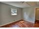 Bright bedroom features gleaming hardwood floors and a sun-filled window at 1177 Castle Way Way, Norcross, GA 30093