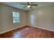 An empty bedroom with natural light, hardwood floors and neutral walls at 1177 Castle Way Way, Norcross, GA 30093