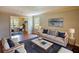 Comfortable living room showcasing stylish furniture and an open layout to the dining area at 1177 Castle Way Way, Norcross, GA 30093